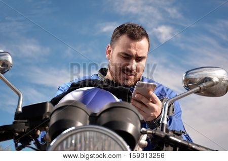 Biker Talking By Phone With His Smarth Phone