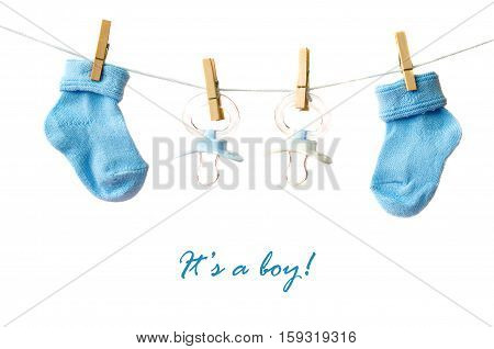 It's a boy! Baby socks and pacifiers on the clotheline