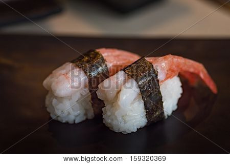Close up of delicious japanese food call nigiri sushi made from sweet shrimp seaweed and japanese rice in local sushi food kanazawa japan.