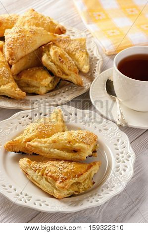 Puff pastry triangles filled with feta cheese and leek.