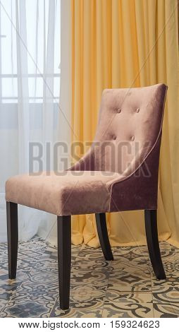 contemporary upholstered chair upholstered in fabric at the window