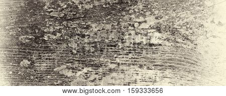 It is a very old damaged board with peeling paint