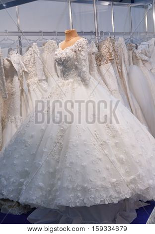 Elegant wedding dresses hanging in a store
