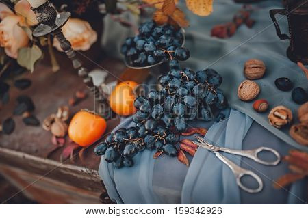 bunch of ripe grapes on a blue cloth