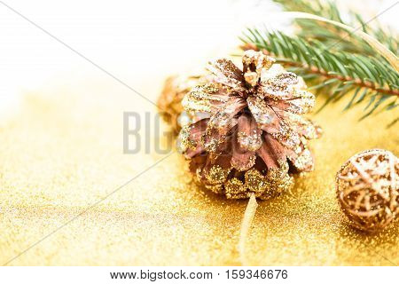Merry Christmas background. New year. Tree, gold, cones, ornaments