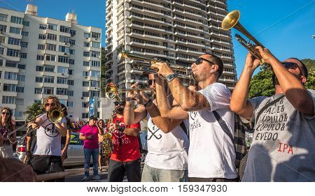 27 November, 2016. Music band playing trombones and saxophone in the street at Festival Fanfare Activist Festival de Fanfarras Ativistas - HONK RiO 2016 near Leme district, Rio de Janeiro, Brazil