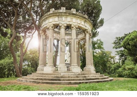 Fantasy Landscape in black and white of an ancient Roman temple with lighting effect in the background