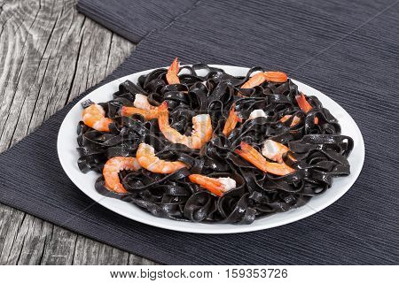 Tasty Cuttlefish Ink Black Noodles With Prawns On White Dish