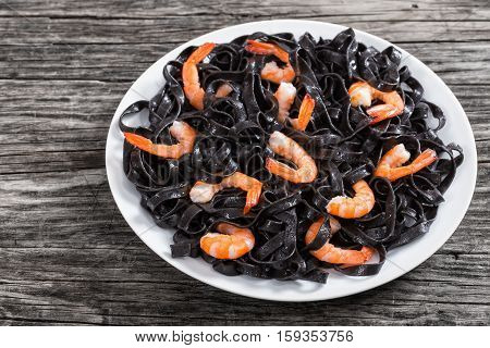 Tasty Cuttlefish Ink Black Noodles With Prawns On White Dish