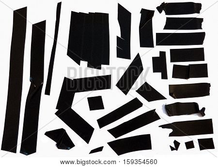 Collection of black adhesive electrical tape pieces