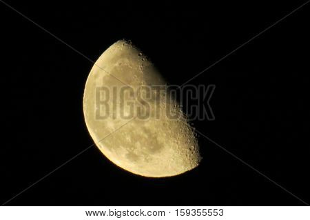 Waning gibbous moon in a dark sky
