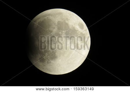 Beginning of a full lunar eclipse in a dark sky