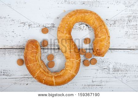 Traditional Dutch cookie Banketletter at Sinterklaas celebration on wooden background