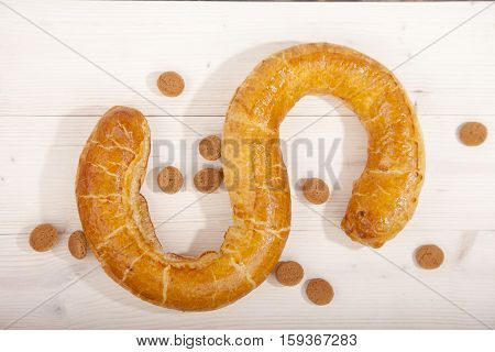 Traditional Dutch cookie Banketletter at Sinterklaas celebration on wooden background