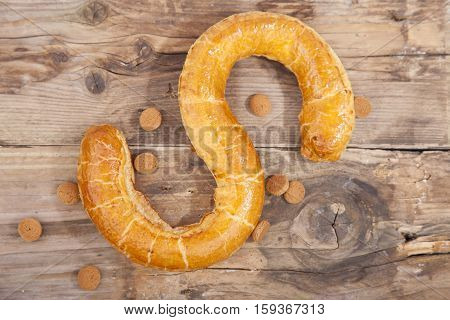 Traditional Dutch cookie Banketletter at Sinterklaas celebration on wooden background