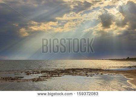 Apulia coast: horizon sea with cloudy sunset. Salento,ITALY. Typical beach with sandy coves and cliffs from Torre Pali to Pescoluse.