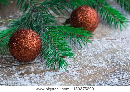 Christmas Tree Green Branches, Orange Balls, Winter Snowbound Wooden Background