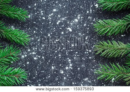 Xmas Tree Branches On Winter Snowflakes Black Space Background