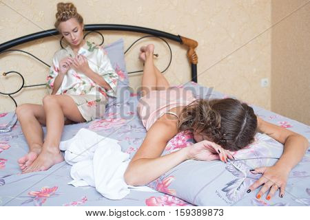 Two sexy young women in bed. beautiful gentle girlfriend
