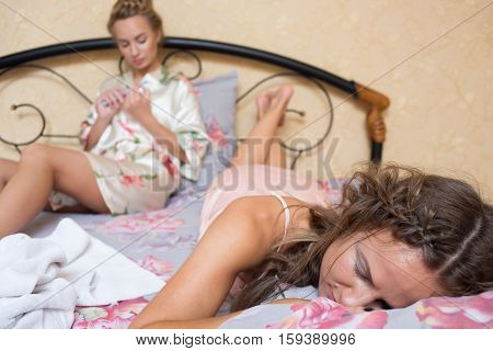 Two sexy young women in bed. beautiful gentle girlfriend
