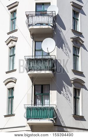 Old House With Balconies And Satellite Dish In Berlin Kreuzberg