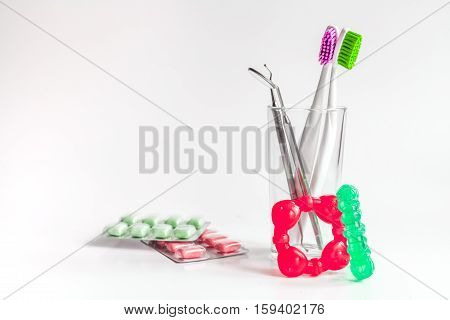 toothbrushes in glass on white background tools for oral care.