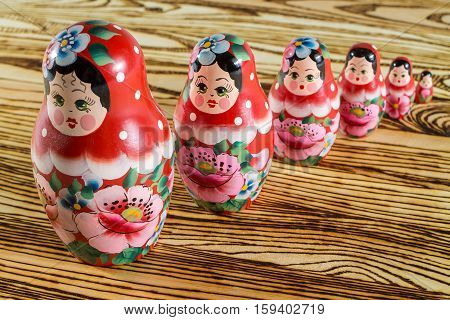 Russian dolls on a wooden table. Matrioshka.