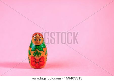 Russian dolls. Matryoshka on pink fabric for the background.