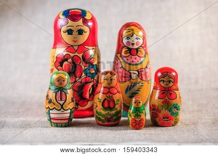 Russian dolls. Matryoshka on linen fabric for the background.