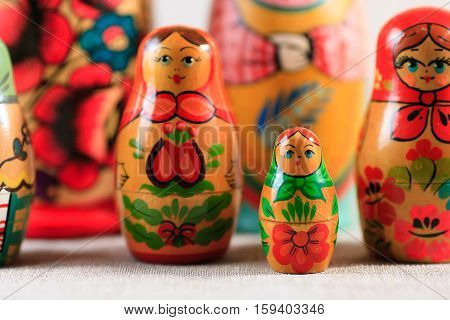 Russian dolls. Matryoshka on linen fabric for the background.