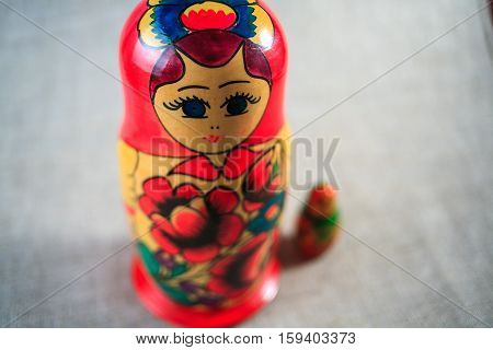 Russian dolls. Matryoshka on linen fabric for the background.