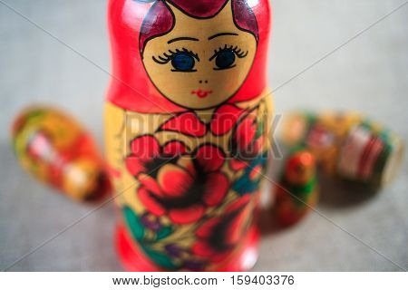 Russian dolls. Matryoshka on linen fabric for the background.