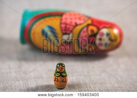 Russian dolls. Matryoshka on linen fabric for the background.