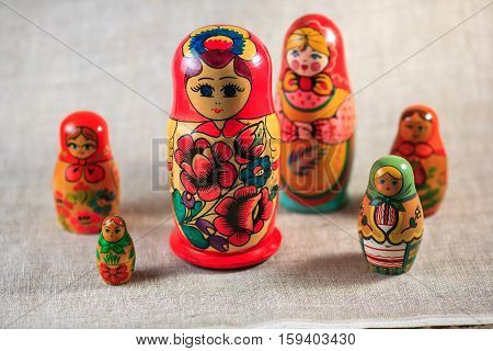 Russian dolls. Matryoshka on linen fabric for the background.