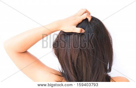 Closeup woman hand itchy scalp Hair care concept