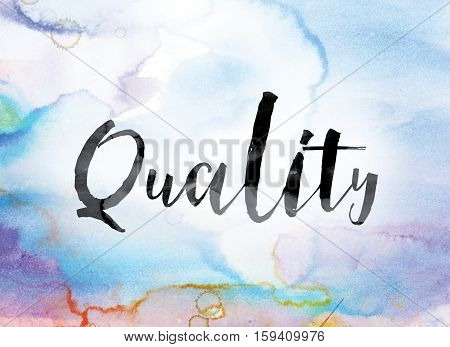 The word "Quality" painted in black ink over a colorful watercolor washed background concept and theme.