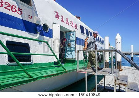 Kota Kinabalu,Sabah-Nov 28,2016:Passengers express ferry arrived from Labuan island in Jesselton terminal,Kota Kinabalu,Sabah.Its a main tourist attraction & cheaper transportation to Labuan Island.