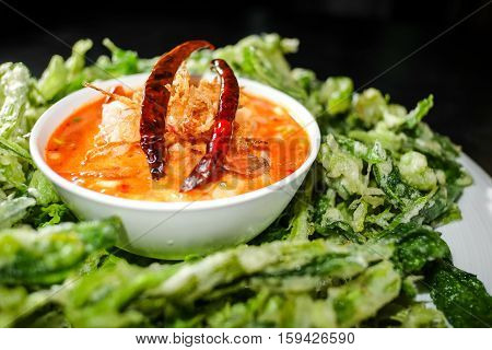 Thai food - Crispy deep fried morning glory served with spicy seafood salad (Yum pak boong krob)