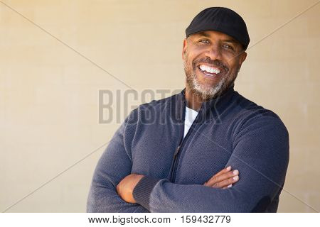 Portrait of an African American sitting outside.
