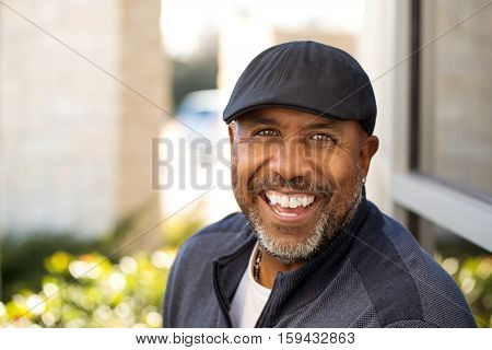 Portrait of an African American sitting outside.