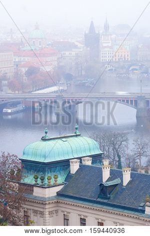 Panorama of an old Prague, bridges and embankment of Vitava river, Czechia