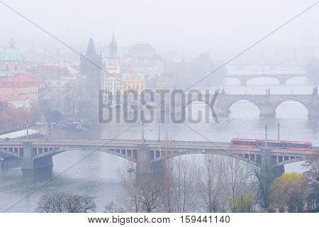 Panorama of an old Prague, bridges and embankment of Vitava river, Czechia