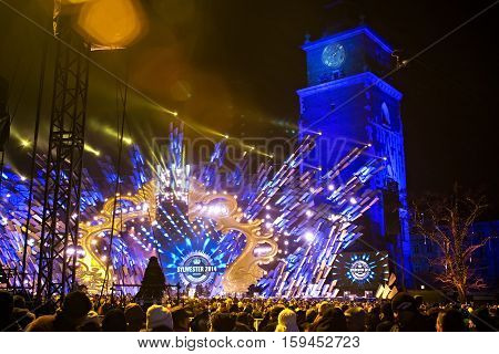 POLAND KRAKOW - JANUARY 01 2015: Celebrating the New Year 2015. People watch the festive show on the Main Market Square in historical center of Krakow.