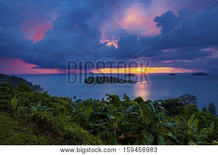 raining over blue sea at sunset time koh chang island trad eastern thailand
