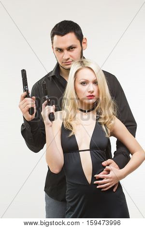 Man detective agent criminal and sexy spy woman with gun. Isolated on white background.