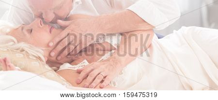 Older Marriage Kissing In Bed