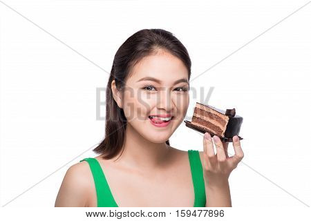 Beautiful smiling asian young woman with a chocolate cake isolated on white background.