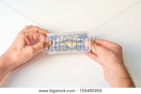Man Holding One Bhutanese Ngultrum Banknote In His Hands
