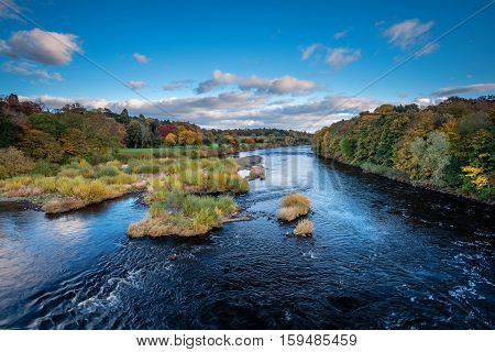 River Tyne below Corbridge, winding its way down the Tyne Valley below Corbridge in Northumberland, on a sunny day