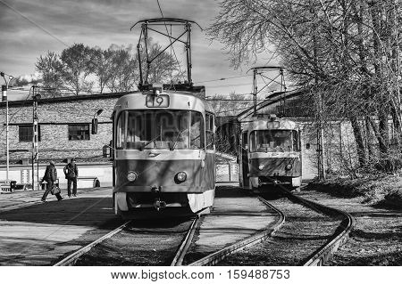 Two trams at a stop of public transport in Yekaterinburg